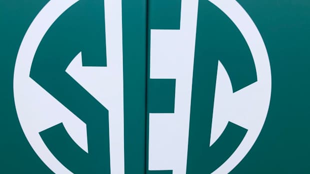 SEC green logo on softball padding